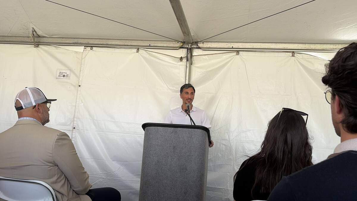 WattEV CEO Salim Youssefzadeh addresses the crowd at the grand opening.