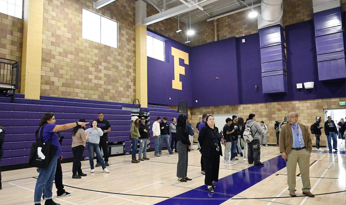 A crowd gathers for a ribbon-cutting ceremony at Fresno High's new auxiliary gym Thursday, Feb. 5, 2026 in Fresno.