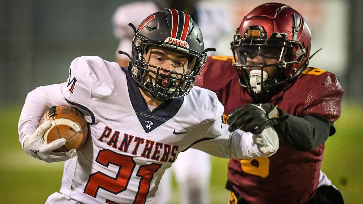 Memorial’s Ryan Wristen, left, skirts downfield on a screen pass before being knocked out of bounds by Clovis West’s David Cummings during their Central Section semifinal playoff game at Lamonica Stadium in Clovis on Friday, Nov. 18, 2022.