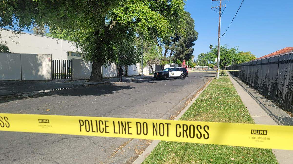 Police tape off the street adjacent to the Fresno Art Museum after a man was shot multiple times on Sunday, April 17, 2022, in Fresno, California.