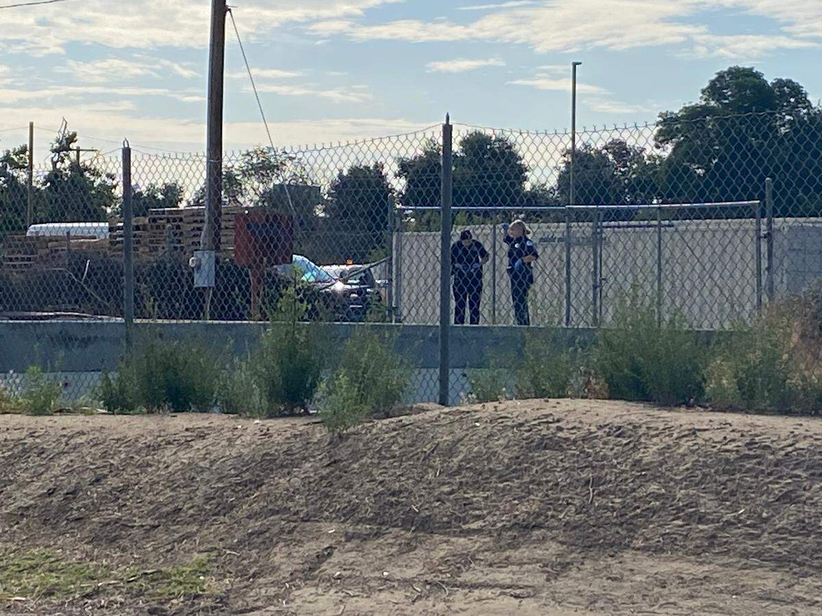 Fresno police investigate a bridge and canal where a body was found between downtown and the Tower District on Monday, June 12, 2023.
