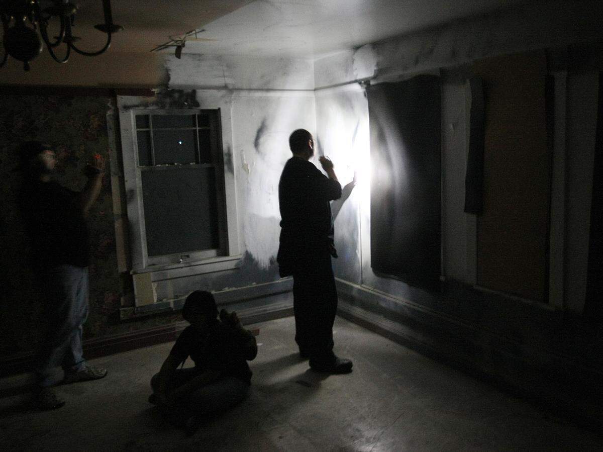 Paranormal investigators search for clues of the paranormal at Wolfe Manor in Clovis.
