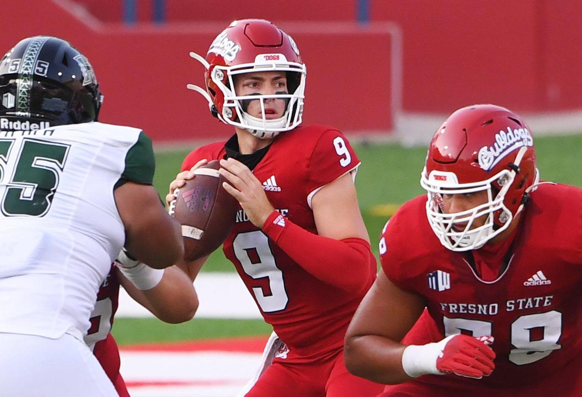 Fresno State’ quarterback Jake Haener, center, looks to pass against Hawai’i Saturday, Oct. 24, 2020 in Fresno. The first quarter ended tied 7-7.