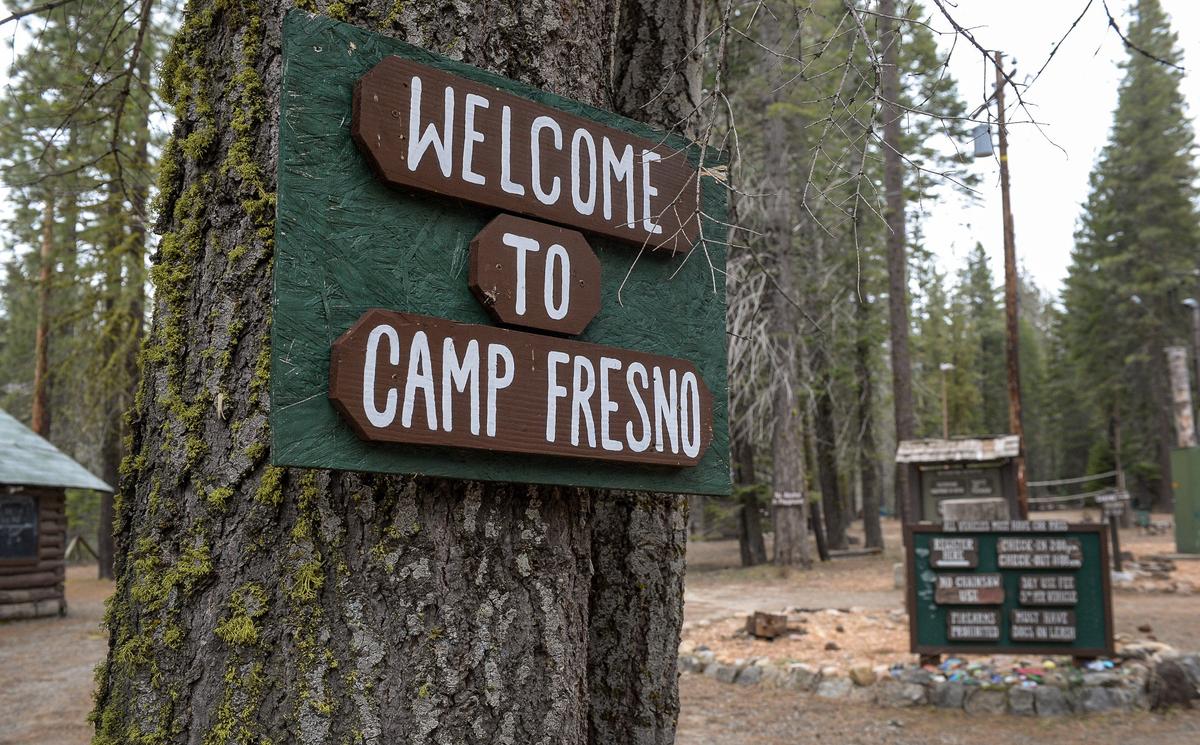 A sign welcomes visitors to Camp Fresno near Dinkey Creek in the Sierra National Forest on Monday, May 6, 2019. The city of Fresno, which operates the camp under a lease from the National Forest Service, is proposing to raise fees to provide more regular maintenance of camp facilities.