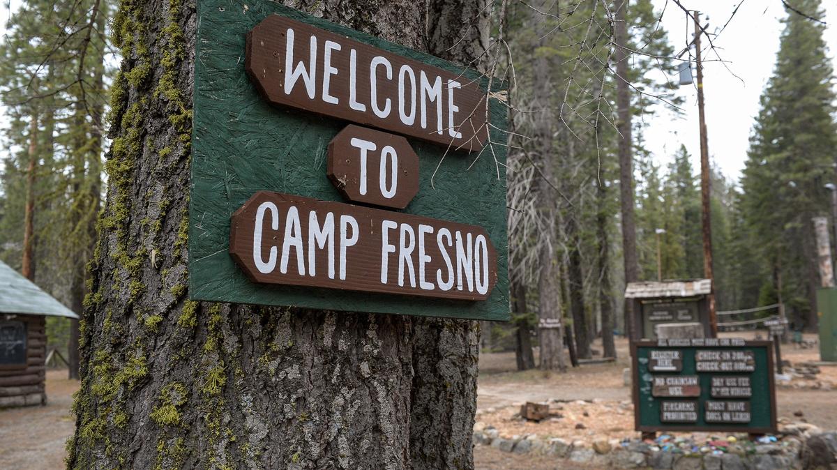 A sign welcomes visitors to Camp Fresno near Dinkey Creek in the Sierra National Forest on Monday, May 6, 2019. The city of Fresno, which operates the camp under a lease from the National Forest Service, is proposing to raise fees to provide more regular maintenance of camp facilities.