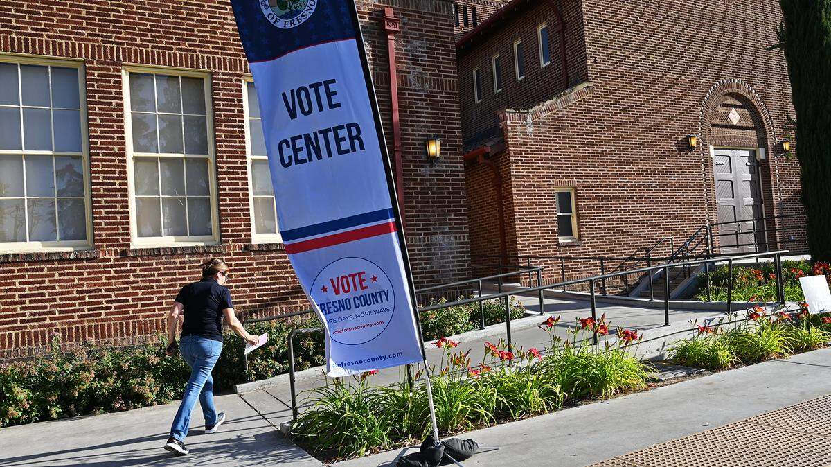 A voter hurries into the voting center at Fresno City College’s Old Administration Building on Tuesday, June 7, 2022 in Fresno. Voter turnout for the June primary in Fresno County was less than 27% – the second lowest for a midterm primary since 1982.