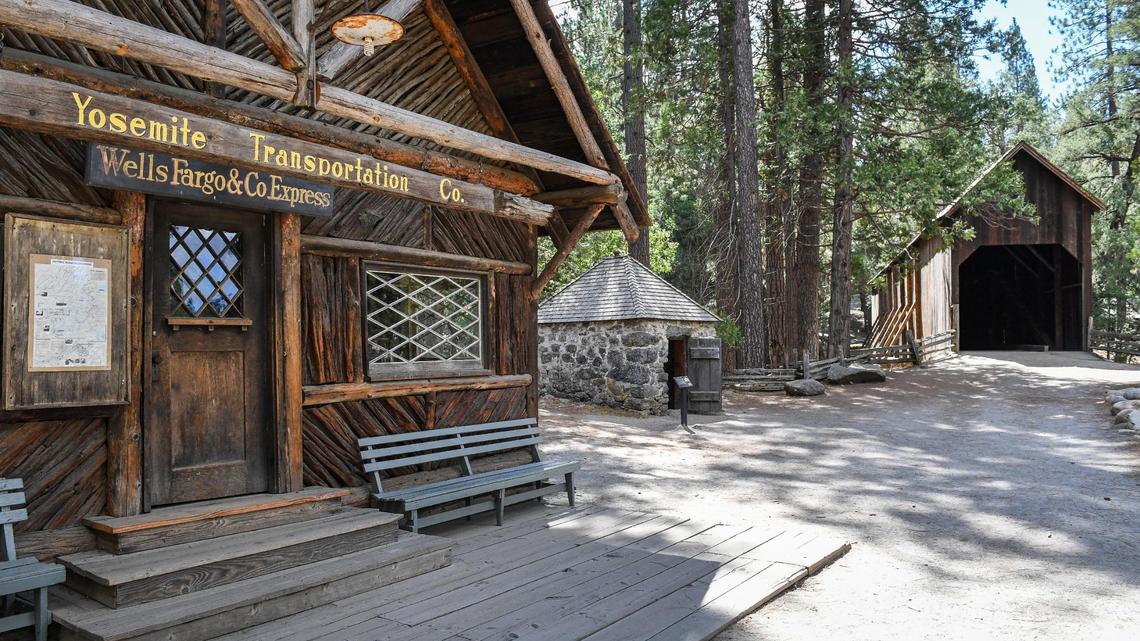 Historic buildings including the Yosemite Transportation Co. building, the powerhouse/jail and the covered bridge stand in the Yosemite History Center in Yosemite’s Wawona on Tuesday, Sept. 28, 2021.
