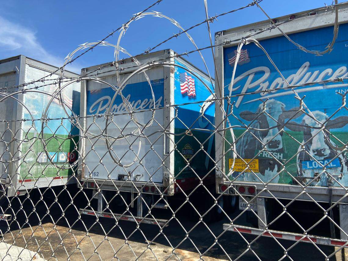 These three Producers Dairy trucks are among dozens parked behind the abandoned Central Valley Cheese building on Belmont Avenue. South Tower residents have long complained about truck traffic in their neighborhood.
