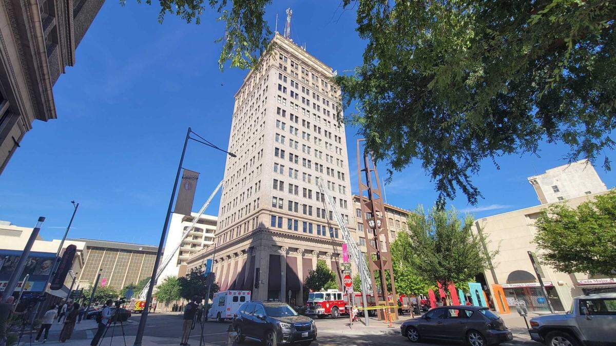 Fresno firefighters surround the Pacific Southwest building in downtown Fresno, California, on Sunday, June 6, 2021. A fire damaged the 14th floor of the building and an apartment below had water damage.