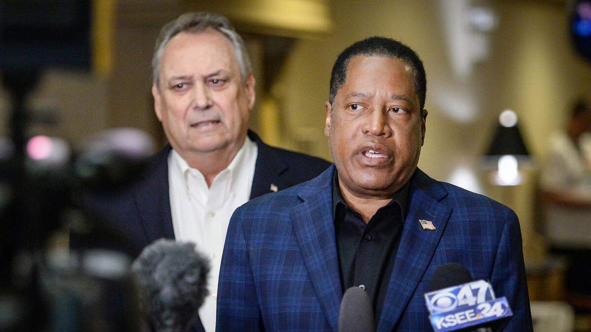 Republican candidate for California governor Larry Elder speaks to the media with former California Secretary of State Bill Jones beside him before meeting with Central Valley farmers at the Piccadilly Inn Airport in Fresno on Thursday, Sept. 9, 2021.