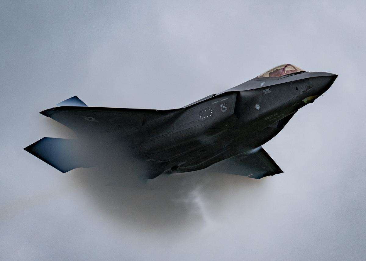 A U.S. Air Force F-35A Lightning II fighter jet piloted by Maj. Kristin Wolfe approaches Mach 1, the sound barrier, during an air show in Oregon in May 2022.
