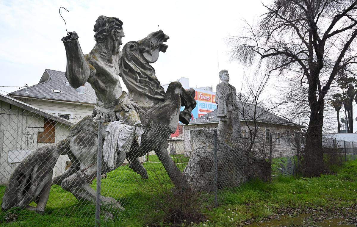 We take a look at two statues and their molds, one of David of Sassoon and another of John F. Kennedy, both stored in a backyard near freeways 41 and 180 near the warehouse district of Fresno, photographed Thursday, Jan. 22, 2026.