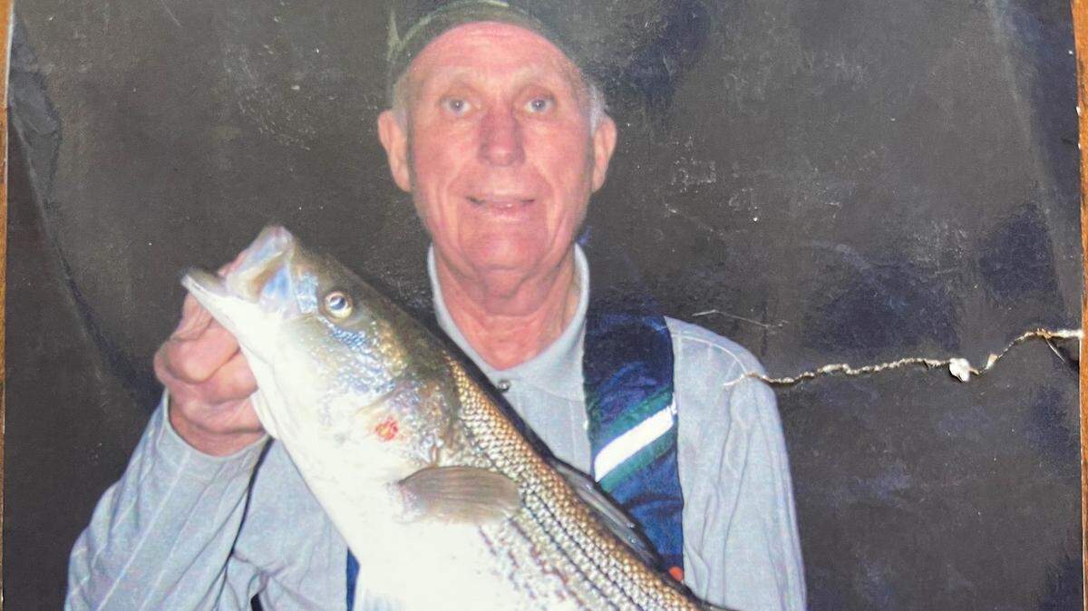 Roger George’s dad, Warren George, with their last striper together, a 12-pounder caught it at last sunlight.
