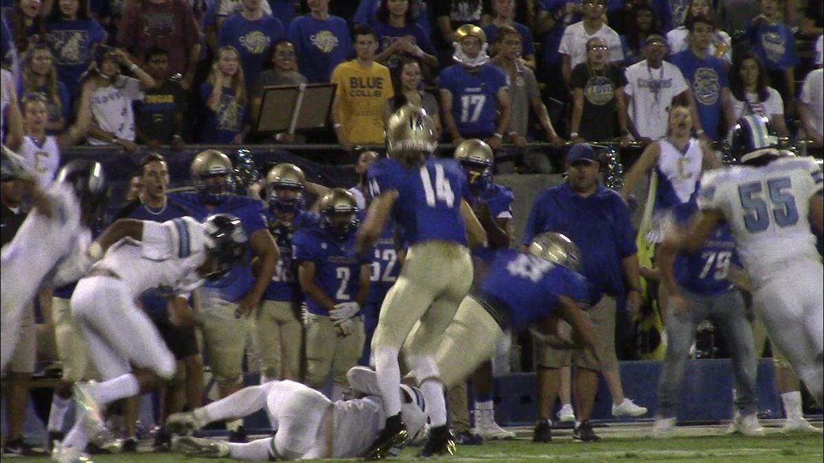 Clovis High running back Phoenix Jones extends for extra yardage. The Bee’s eight-ranked Cougars held off Bullard 17-14 in a nonleague game at Lamonica Stadium on Friday, Aug. 31, 2018.