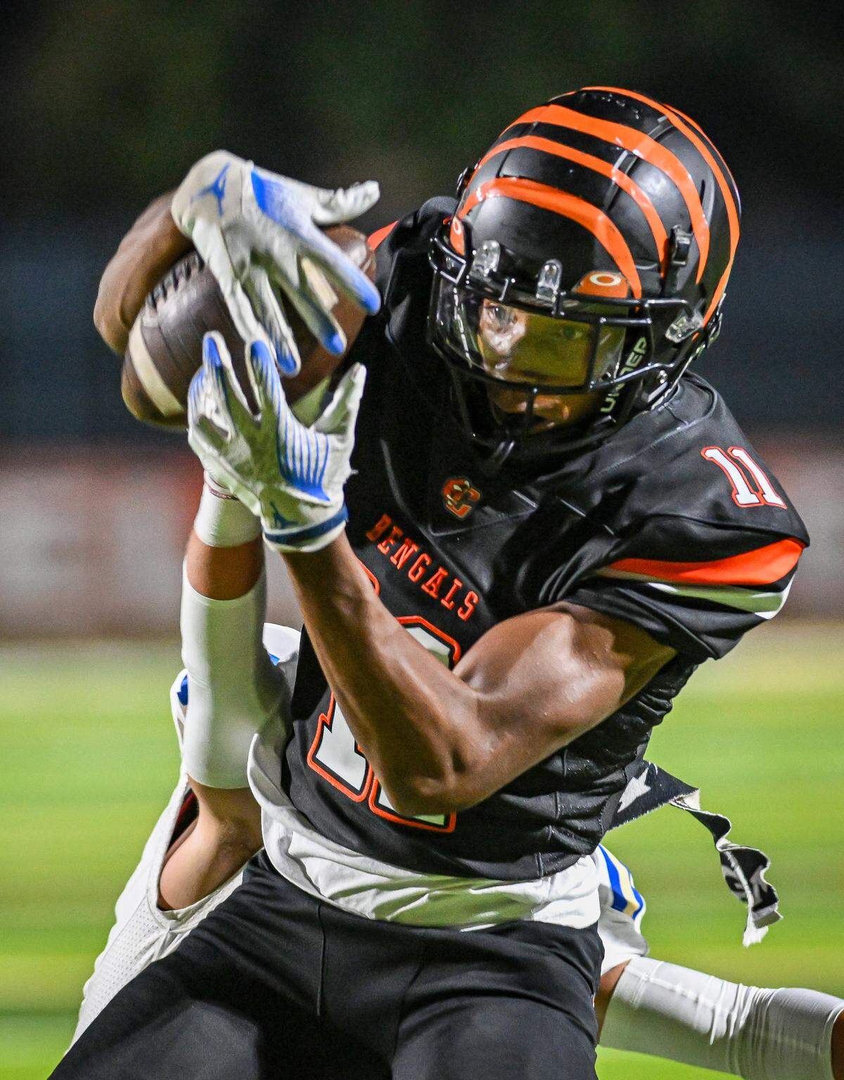 Central East's Titus Thomas hauls in a long pass for a touchdown against Clovis in their game at Koligian Stadium in Fresno on Friday, Oct. 24, 2025.