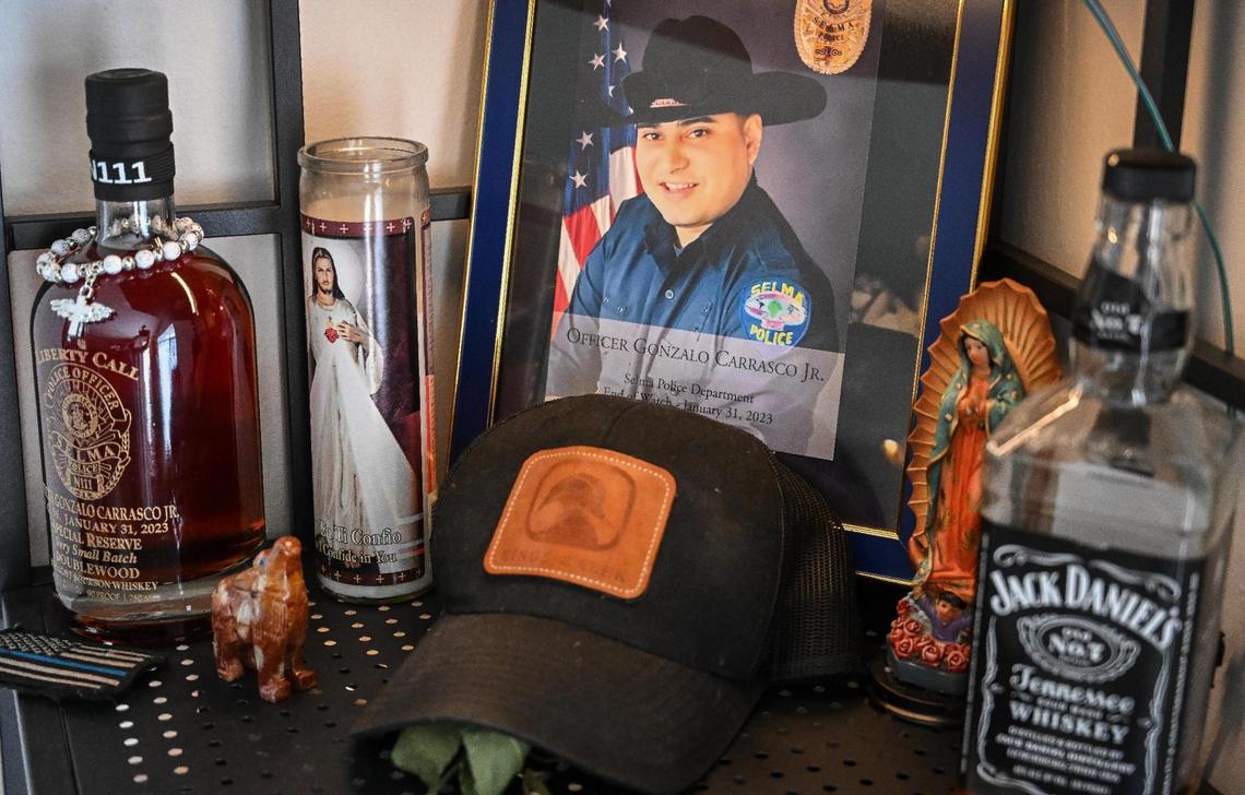 A shrine to Gonzalo Carrasco Jr sits on a shelf at Karla Alvarez’s home in Dinuba on Tuesday, May 9, 2023. Alvarez was nine-months pregnant when Carrasco was killed in the line of duty last January 31, 2023.