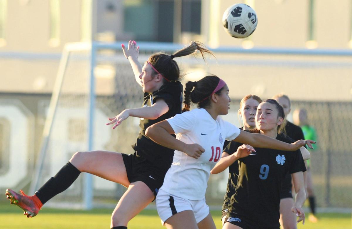 Clovis North’s Lexi Sweatt, left, Hannah Peters, right, and Buchanan’s Daisy Torres, center, seen in a Tri-River Athletic Conference matchup Thursday, Feb. 9, 2023 in Fresno. Clovis North won 1-0.