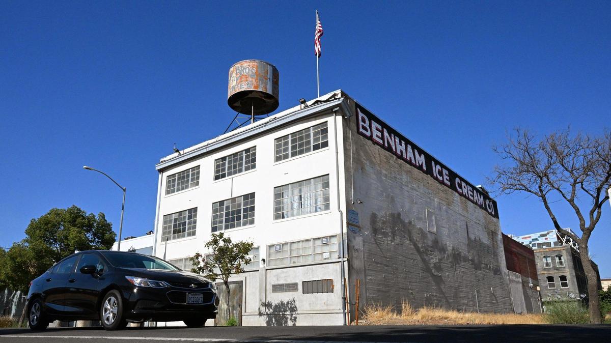The faded and rusted historical Dale Bros. Coffee landmark, seen perched on top of a building on H Street, is slated to be removed. Photographed Tuesday, Oct. 3, 2023 in Fresno.