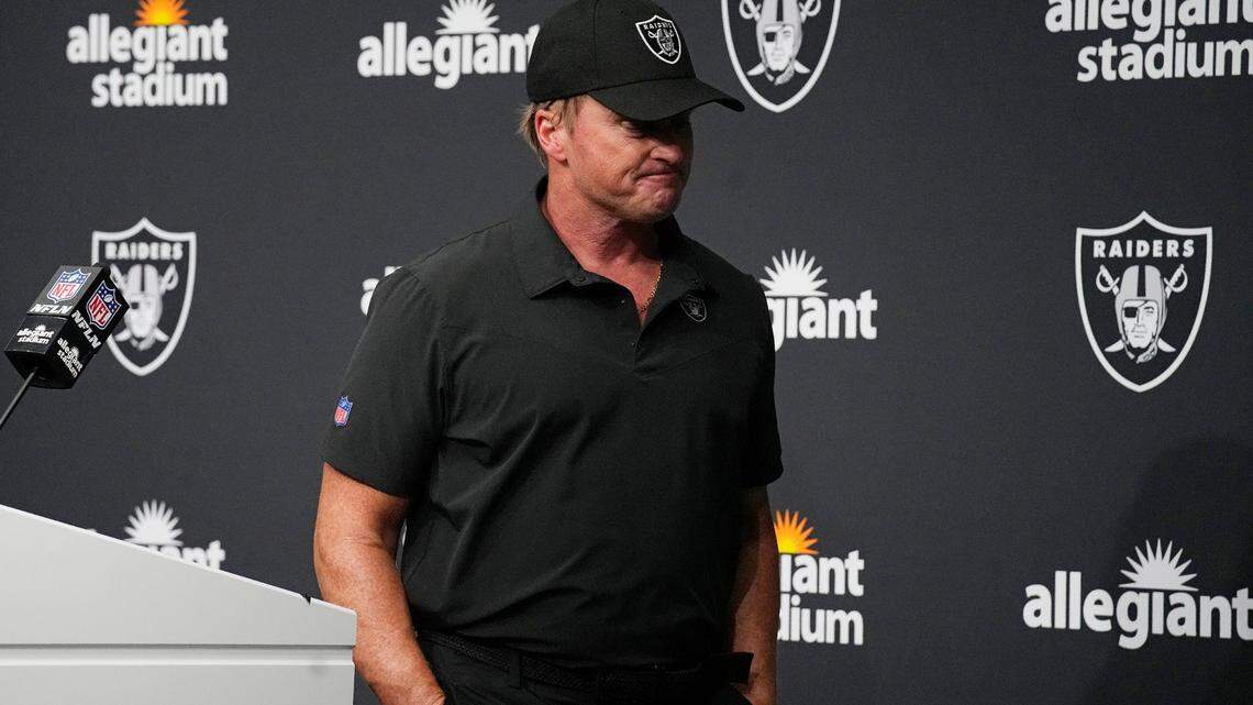 Las Vegas Raiders head coach Jon Gruden leaves after speaking during a news conference after an NFL football game against the Chicago Bears, Sunday, Oct. 10, 2021, in Las Vegas.