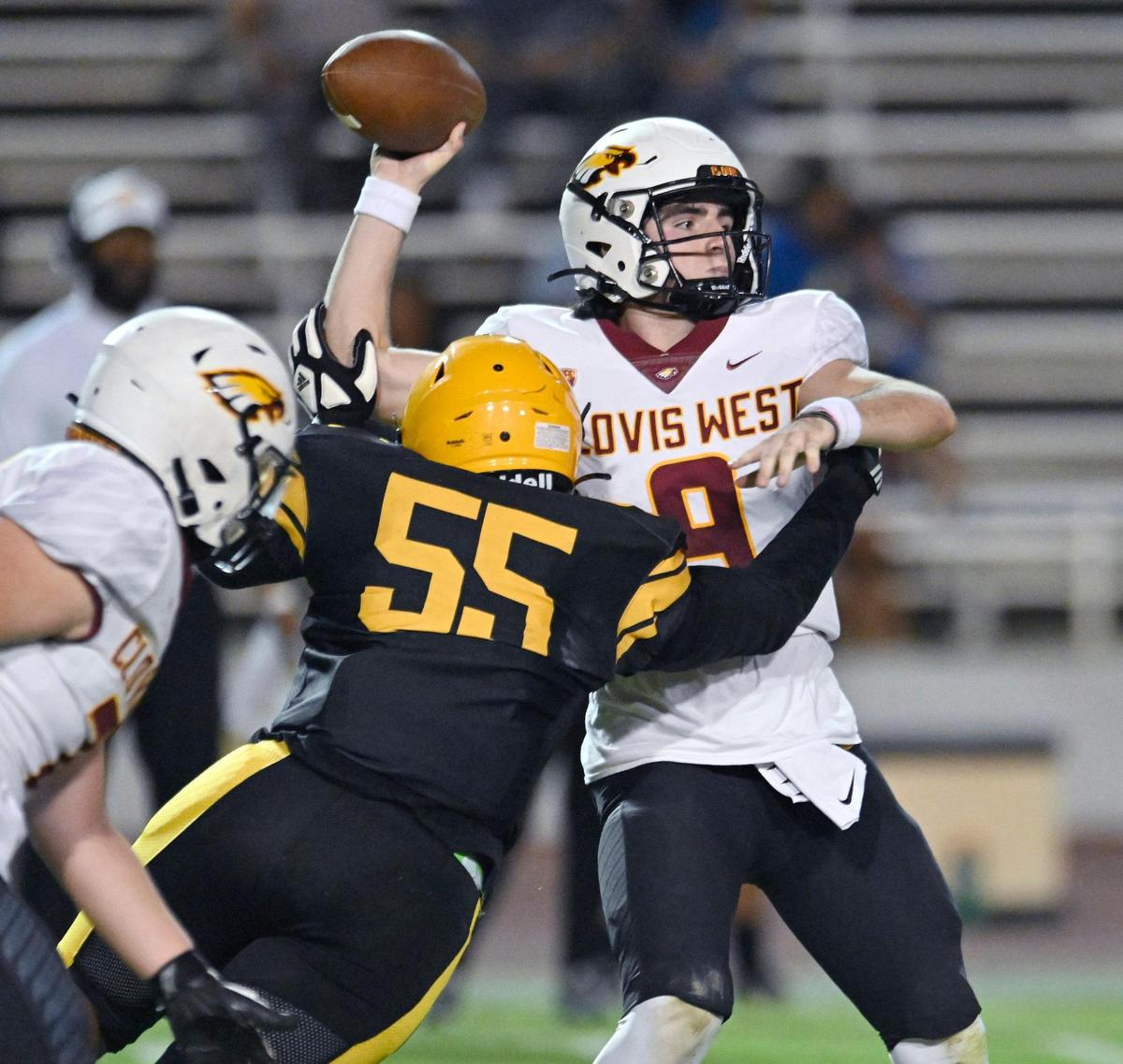Edison’s Nick Ball, foreground, pressures Clovis West quarterback Tyler Patrick Friday, Sept. 15, 2023 in Fresno.