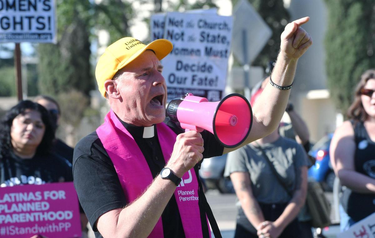 Rev. Tim Kutzmark of the Unitarian Universal Church of Fresno speaks in support as hundreds turned out to protest the Supreme Court’s overturning of Roe vs. Wade Saturday morning outside City Hall, June 25, 2022 in Fresno.