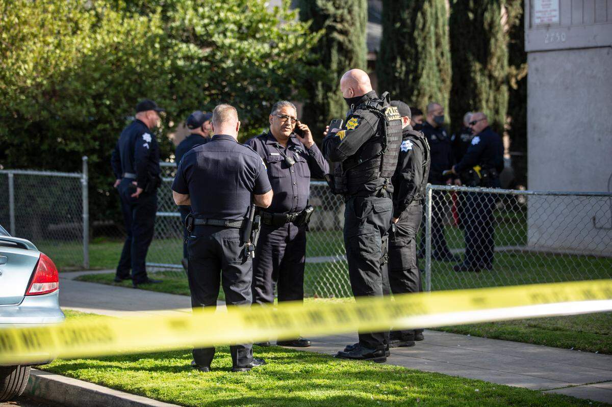Fresno police investigate a fatal shooting following a domestic disturbance call at a downtown apartment complex Feb. 14, 2021.