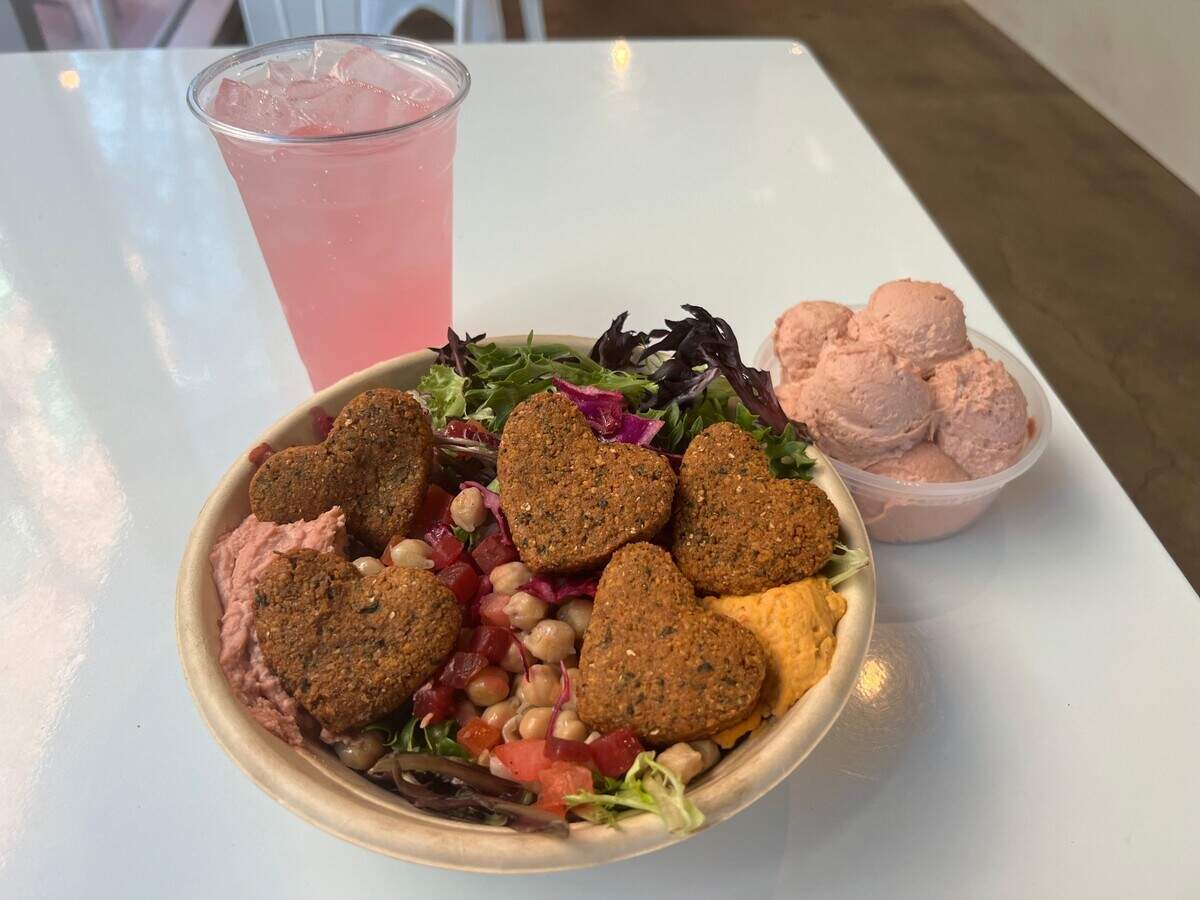 Falafel bowl, pink hummus and pink dragon fruit lemonade at Hummus republic in Fresno located at 2424 Tulare St in Fresno.