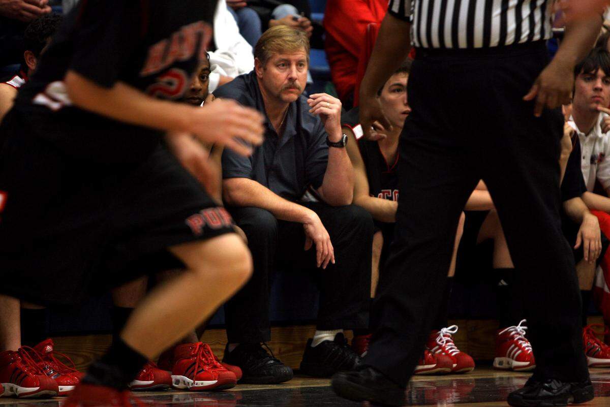 File photo of Hanford boys basketball coach Brad Felder watches his team during the third quarter of the game with Hanford West Friday, January 11, 2008.