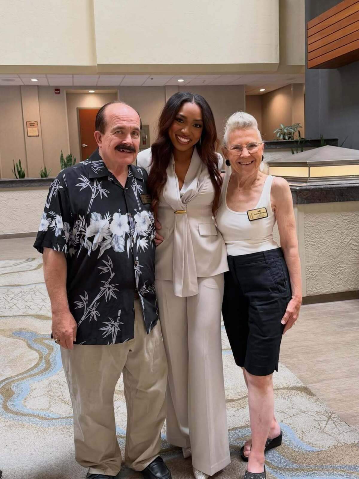 Love d’Encarnacao Bradley poses with Ken and Coleen Rockey of the Miss Los Angeles County scholarship organization.