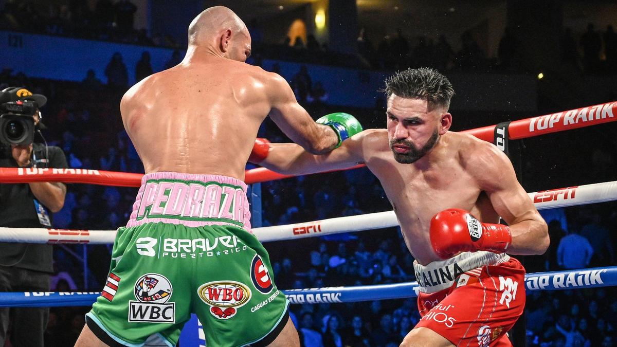 Jose Ramirez, right, lands a punch against Jose Pedraza during their junior welterweight fight at the Save Mart Center on Friday, March 4, 2022.