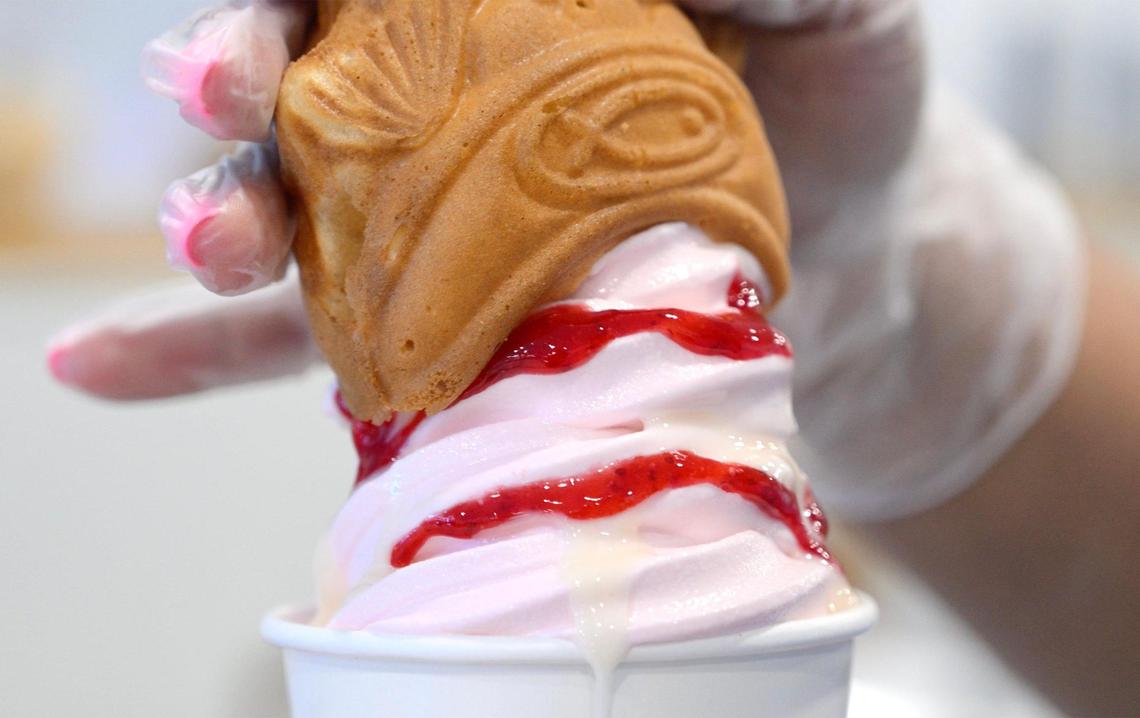 A soft serve is topped at Sophea and David Thach’s new Sweet Ppang. Photographed Tuesday, Nov. 12, 2024 in Fresno.