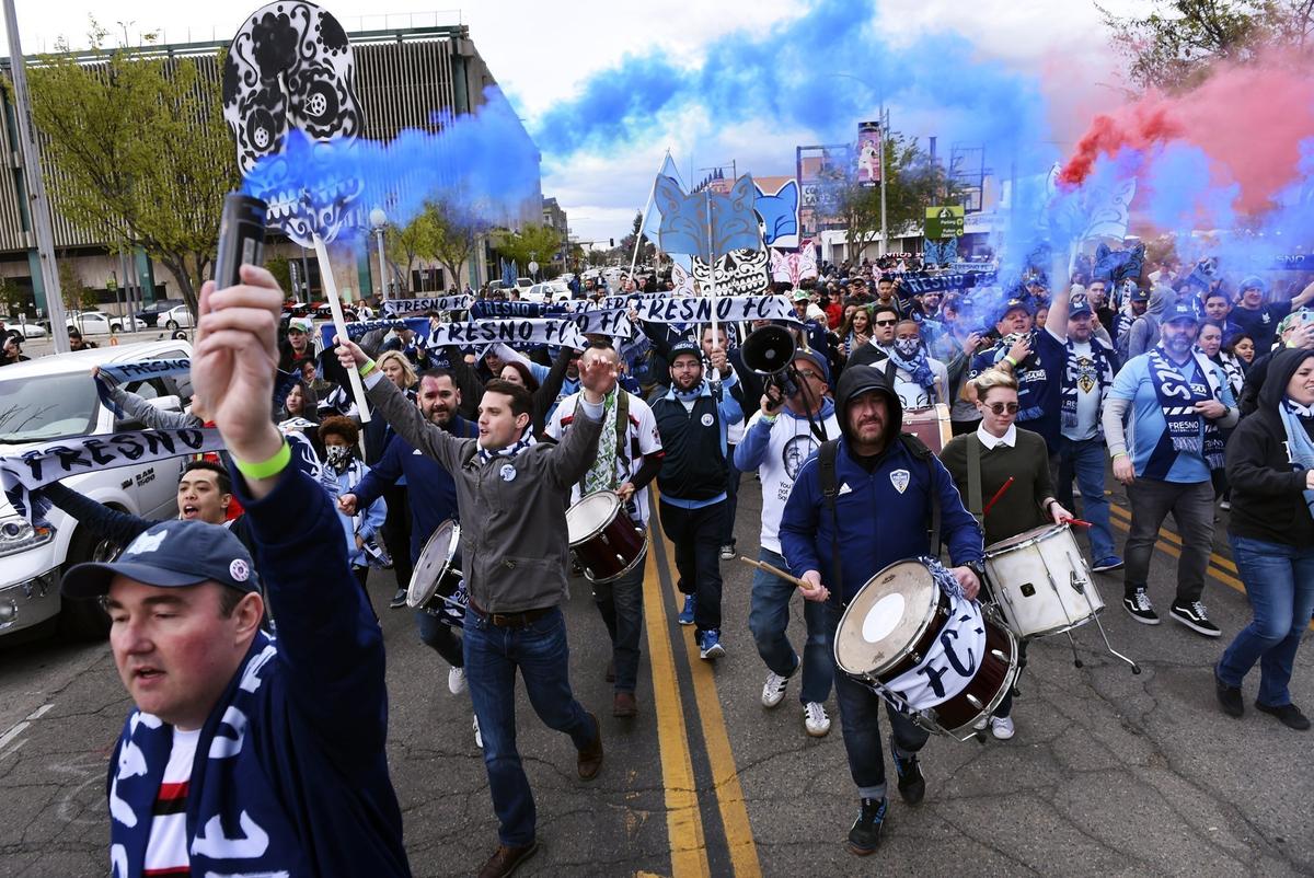 Fire Squad Fresno begins its march from Tioga-Sequoia Brewery before the start of Fresno Footbal Club’s game against Las Vegas Lights FC Saturday, March 17, 2018 in Fresno.