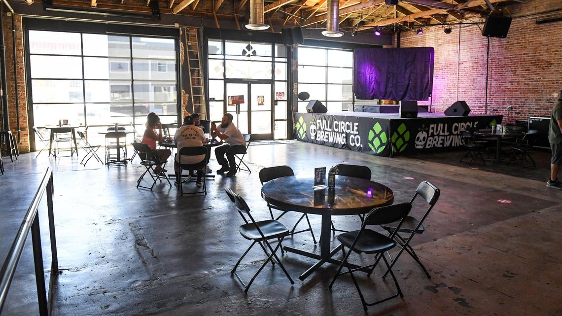 A stage for live performances is set off in the corner at Full Circle Brewing at Fulton and Mono streets in downtown Fresno.
