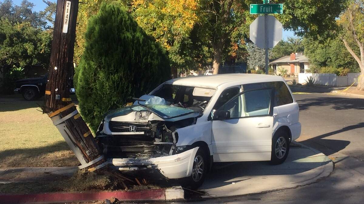 A Honda Pilot crashed into a power pole in central Fresno, CA on Tuesday, causing Fruit Avenue to be closed in both directions at Dayton Avenue while PG&E assessed the damage to the pole.