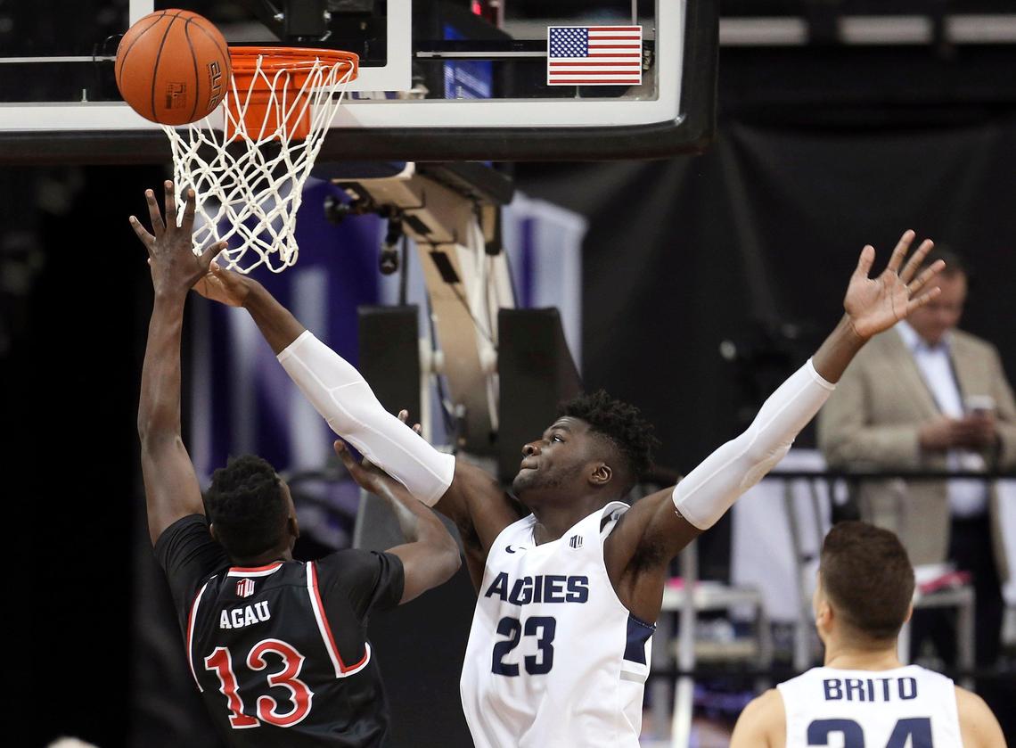 Fresno State’s Aguir Agau (13) shoots as Utah State’s Neemias Queta (23) defends during the first half of an NCAA college basketball game in the Mountain West Conference Tournament Friday, March 15, 2019, in Las Vegas.