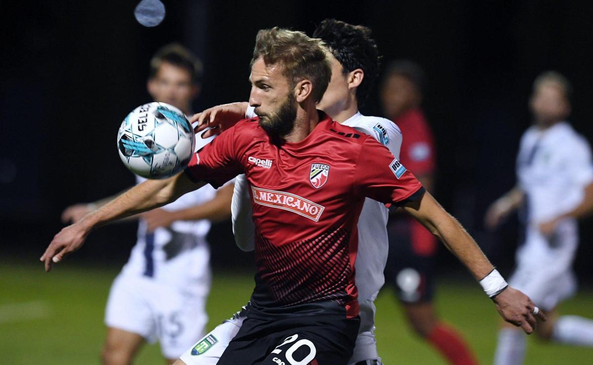 Central Valley Fuego FC’s Villyjan Bijev, foreground controls the ball with Greenville Triumph SC’s Jesus Ibarra in the background in the Fuego’s home opener Saturday night, May 7, 2022 in Fresno.