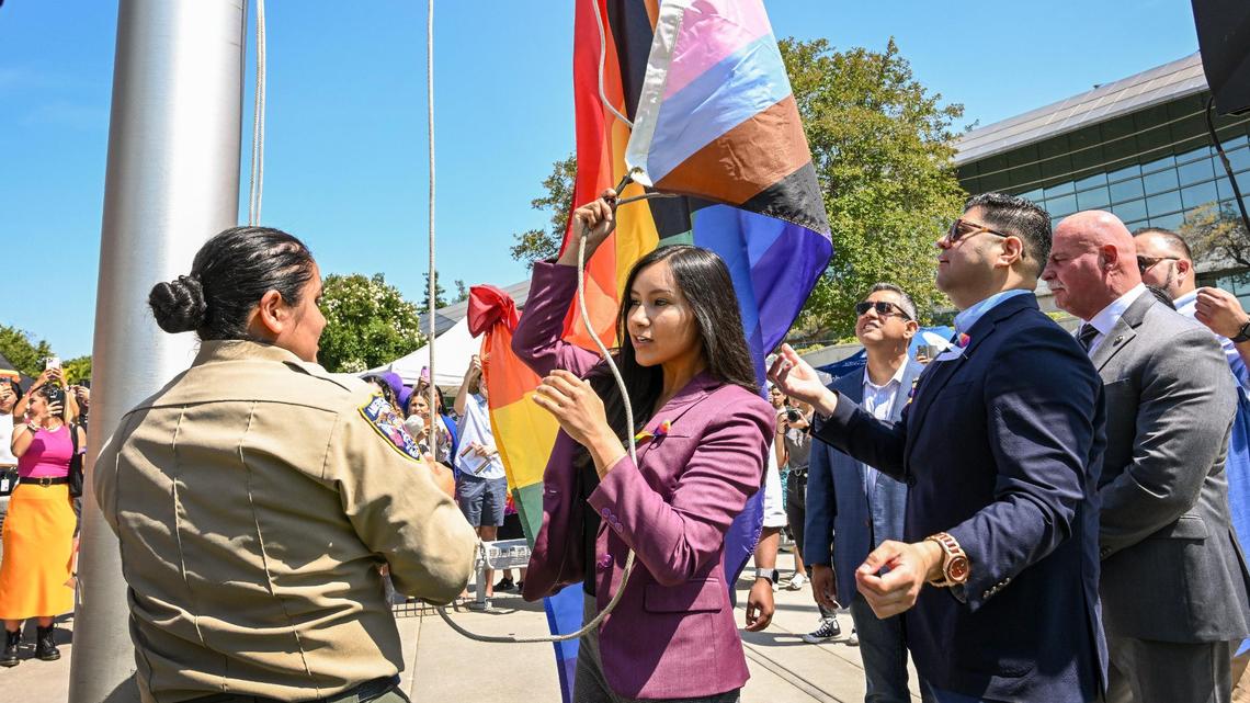 Fresno City Councilmember Annalisa Perea, center, begins to raise the Pride flag with fellow councilmembers and Mayor Jerry Dyer during the 3rd Annual Pride Flag Raising Ceremony at Fresno City Hall on Friday, June 9, 2023.