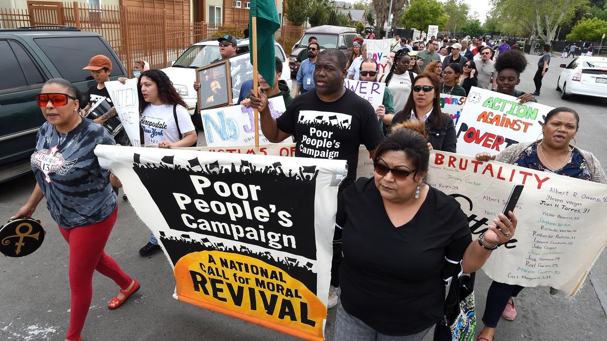 Members of the California Poor People’s Campaign march on F Street near downtown Fresno in 2019 to raise awareness of poverty. Across Fresno, Kings, Madera, Merced and Tulare counties, about one out of five residents live in poverty, according to Census Bureau estimates.