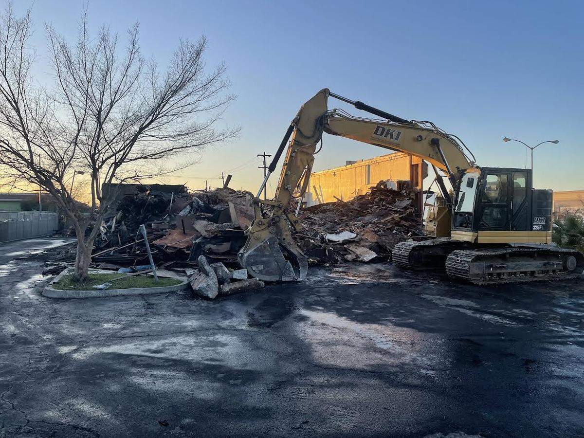 Crumpled steel girders, broken glass, and shattered wood were all that remained Monday, Jan. 30, 2023, after an overnight fire at the Fagbule Glass House on Shields Avenue near Highway 41 in Fresno.