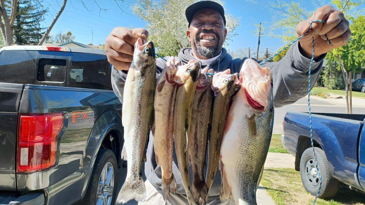 Randy Schmidt of Fresno says, “I asked one of my co-workers if they would like to try and go troll for the planted trout the Fish and Game have been planting in Hensley Lake. Stanford jumped on the opportunity and using crawdad crank baits created a frenzy fishing trip. Several 12- to 14-inch bass fighting for the baits with the trout trying to get their fill. Sanford finally hooked up with a good keeper bass.”
