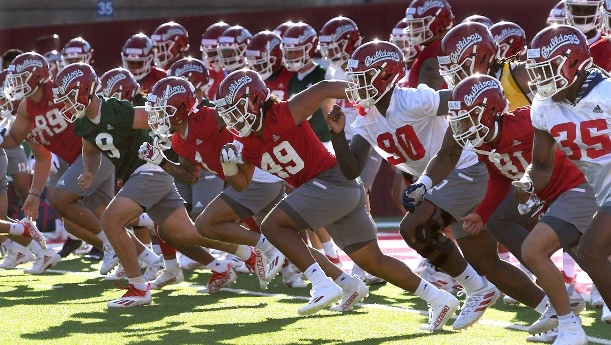 Bulldog players run a series of sprints to kick off the first day of spring practice, Monday March 21, 2022.