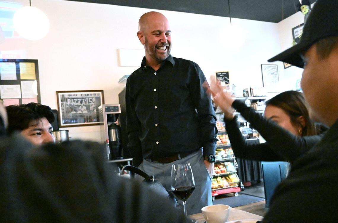 Fresno Unified School board incumbent Andy Levine, center, gathers with supporters at Moto Delicatessen and Bodega Tuesday night, Nov. 5, 2024 in Fresno.