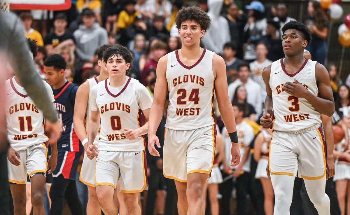Clovis West players, from right, Marshel Sanders, Tyus Parrish-Tillman and Isaac Martinez walk off the court for a timeout during their NorCal Open Division boys basketball semifinal against Modesto Christian at Clovis West on Saturday, March 5, 2022.