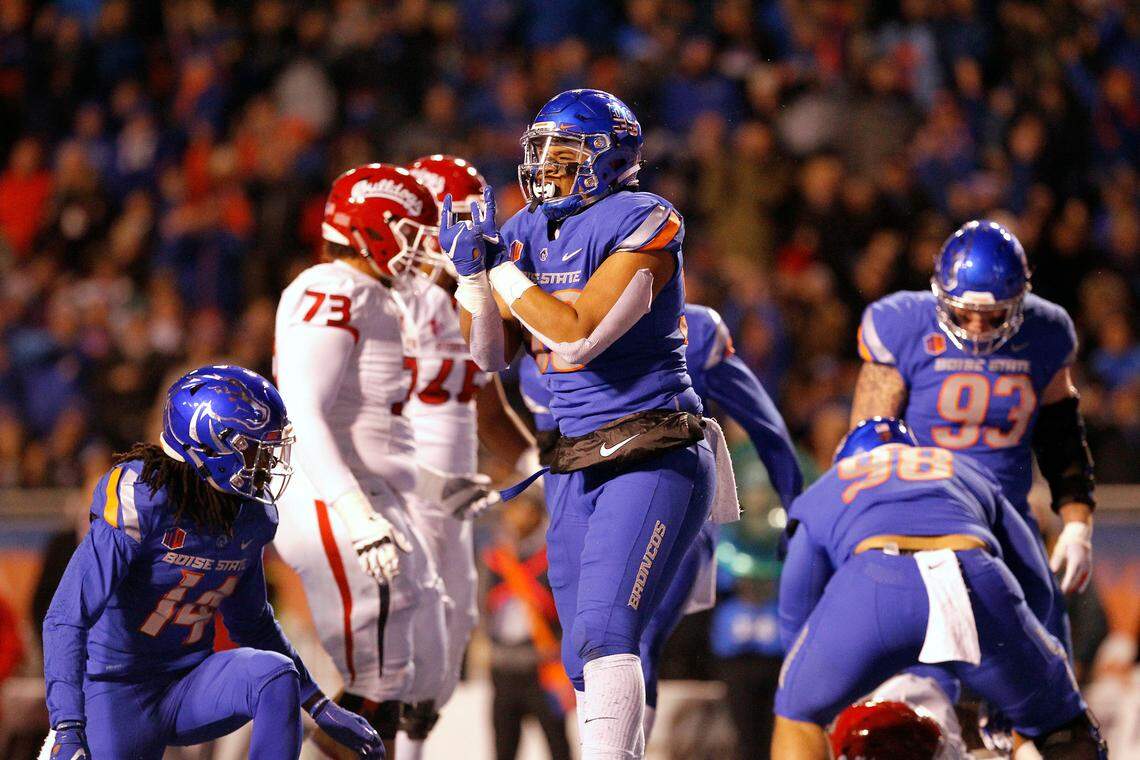 Boise State’s Curtis Weaver (99) celebrates a sack and fumble against Fresno State during the first half of Friday’s game. Bulldogs quarterback Marcus McMaryion coughed it up, but offensive lineman Christian Cronk recovered it to keep Fresno State possession.