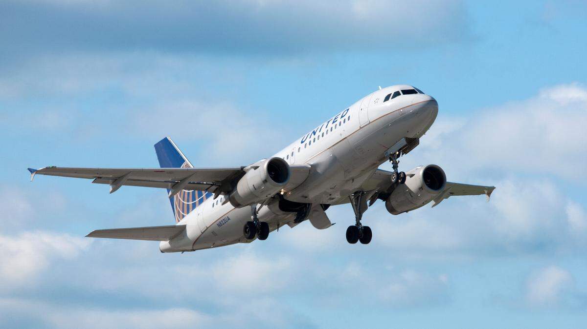 A United Airlines Airbus A319 jet has its landing gear down above Chicago’s O’Hare International Airport. The airline will offer seasonal flights between Fresno Yosemite International Airport and Chicago from May to October 2025.