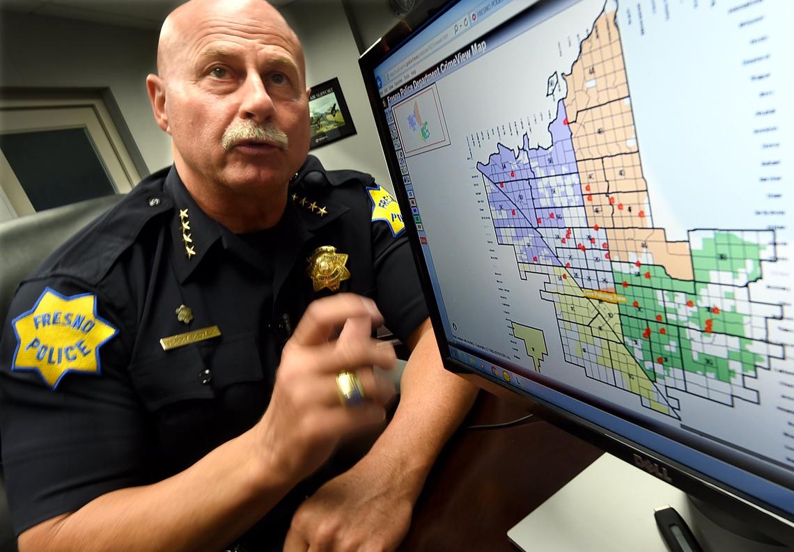 Fresno police Chief Jerry Dyer talks about domestic violence with a map showing police calls within the city.