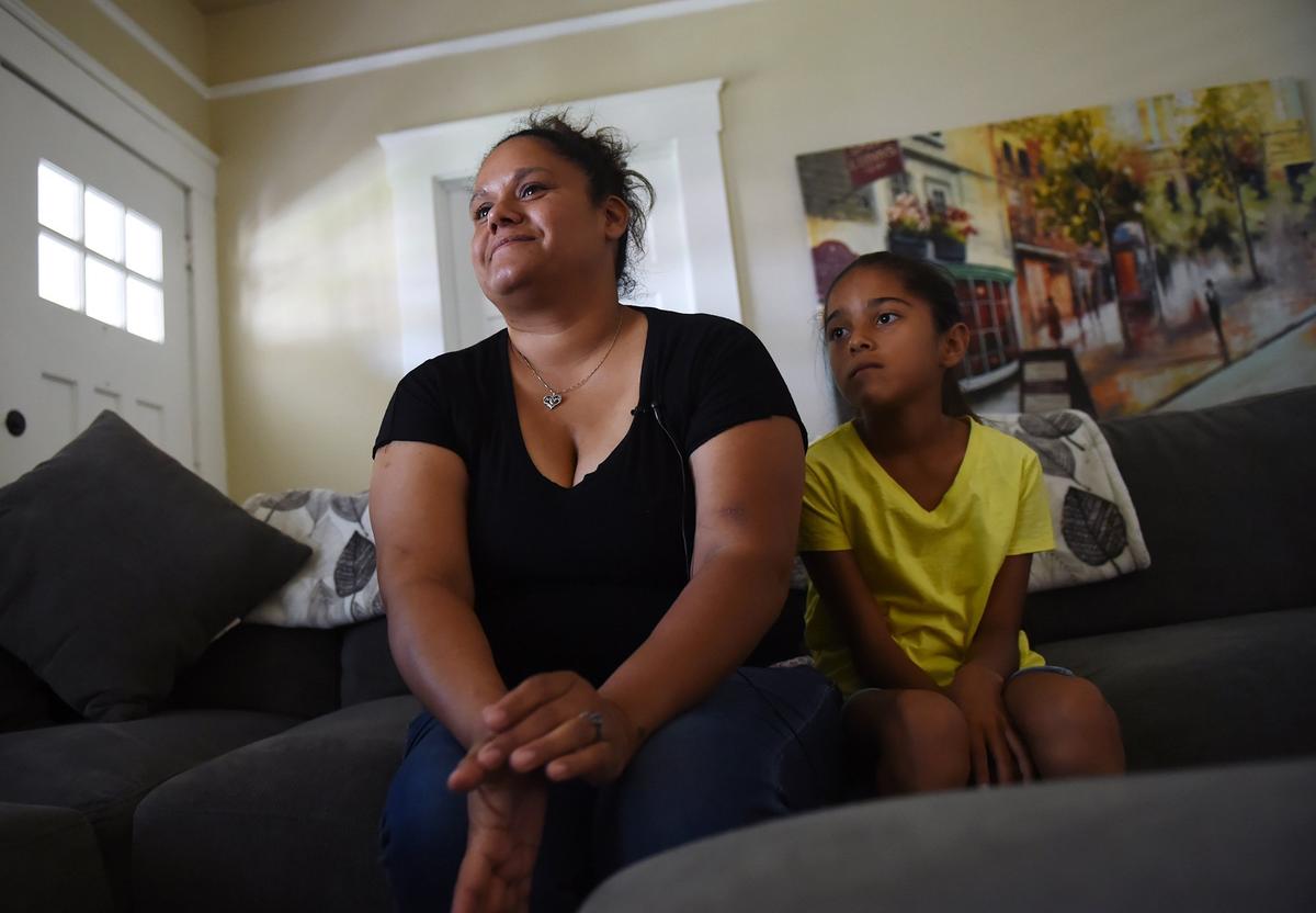 Leanna DelaCruz, a recovering meth addict, sits with her daughter Lily at The Frasieur Home in Hanford. DelaCruz, 35, has four children, ages 8 to 15. The home is one of the few that allows older children to stay with their mothers while they continue with their recovery and work to save money for a place of their own. “It’s a blessing,” DelaCruz says. “This is what we needed.”