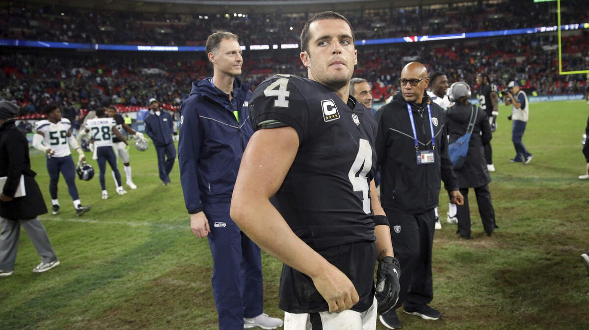 Oakland Raiders quarterback Derek Carr (4), stands on the fieldd at the end of an NFL football game against Seattle Seahawks at Wembley stadium in London, Sunday, Oct. 14, 2018. Seattle Seahawks won the match 27-3.