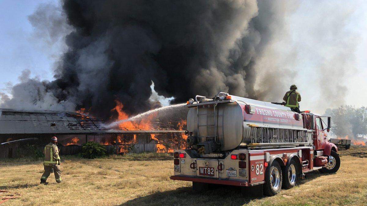 Fresno County and Sanger city firefighters responded to a barn fire Wednesday that nearly destroyed the barn. The fire sent heavy dark smoke into the air.