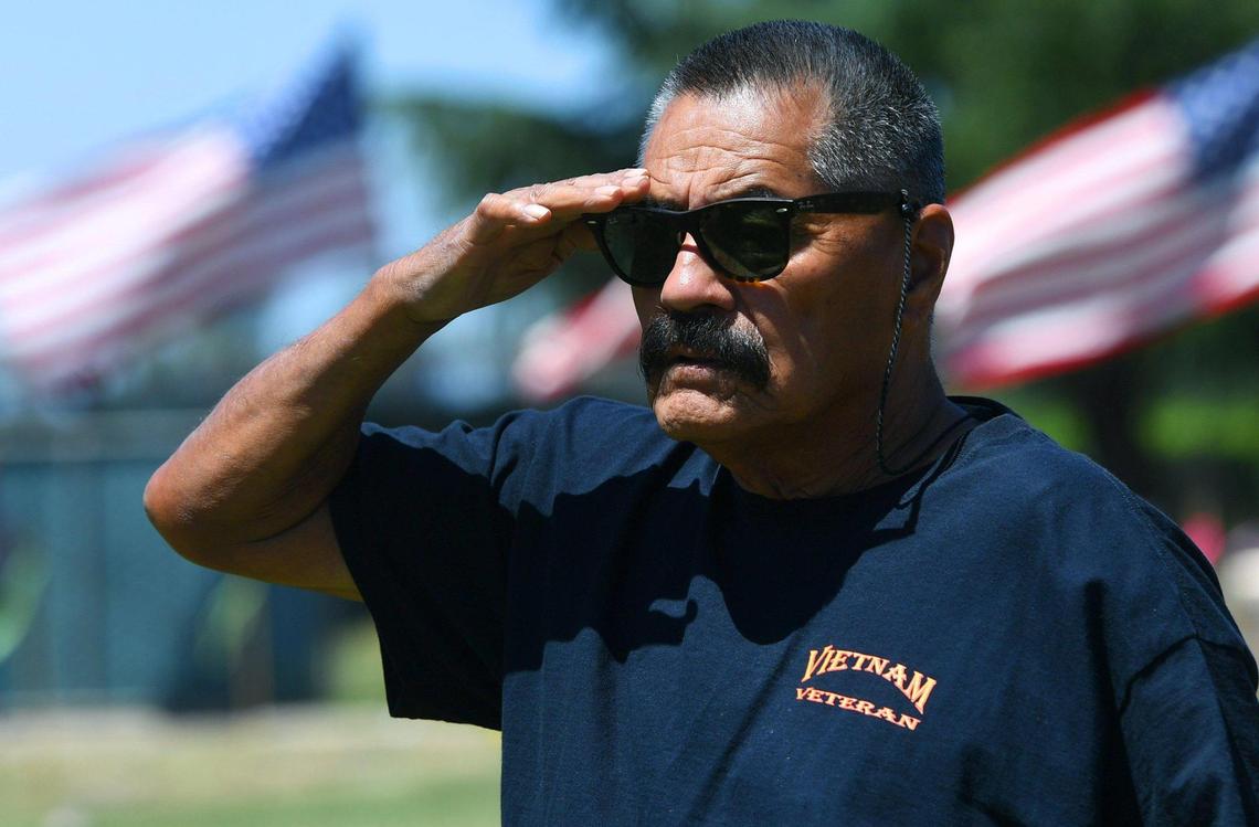 Vietnam veteran Jesse Hernandez from Mendota salutes during the 59th Annual VFW Memorial Day Service at Fresno Memorial Gardens Monday, May 30, 2022 in Fresno.